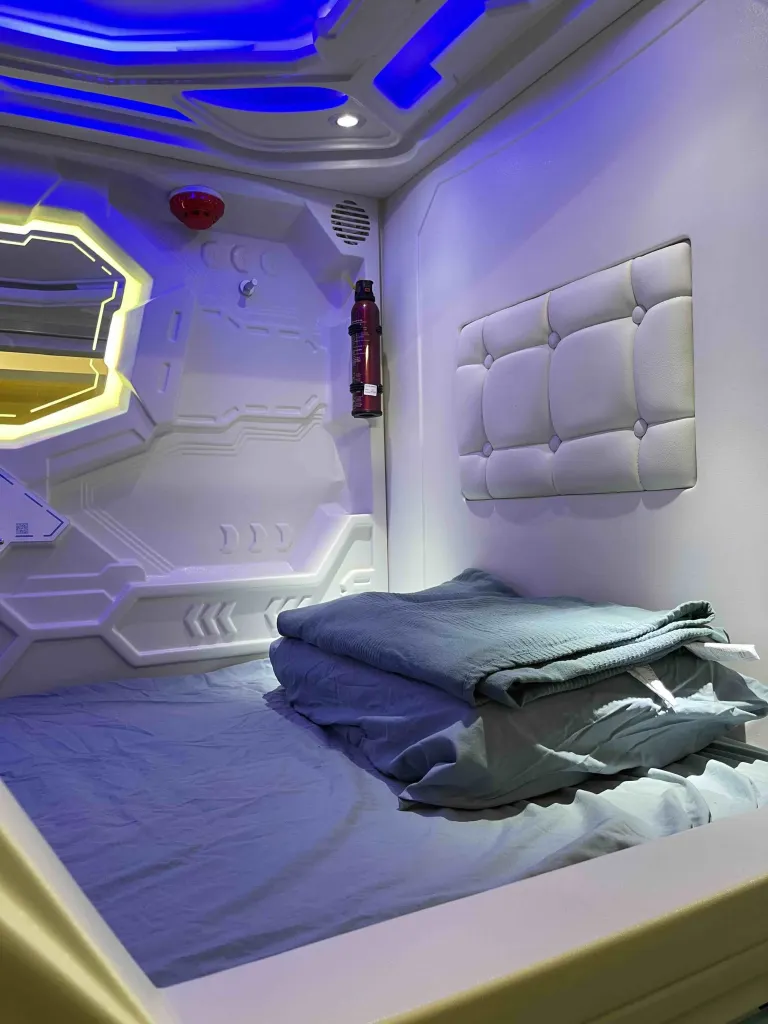 Capsule pod amenities including USB charging ports and personal ventilation at Pelangi Hostel