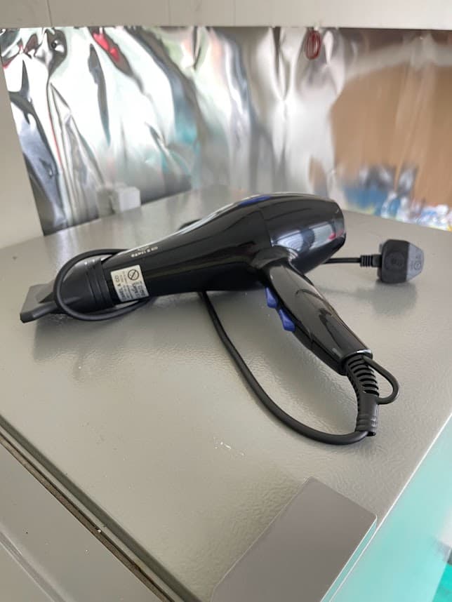 Complimentary hair dryer amenity at Pelangi Capsule Hostel